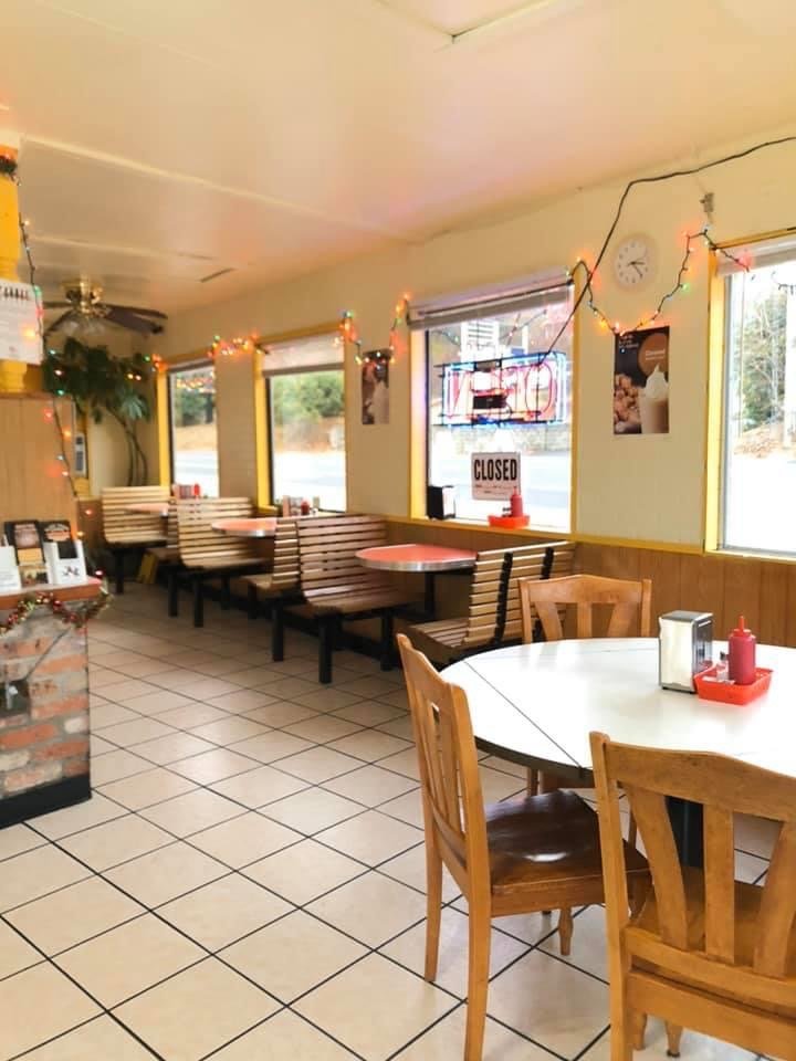 Burgers and fries on a casual diner table.